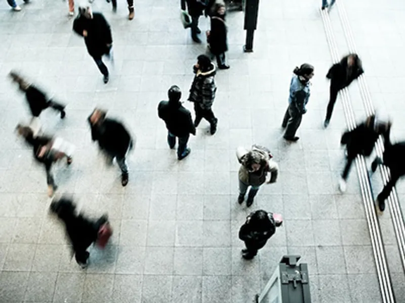 People moving in an organized pattern, symbolizing organizational alignment.